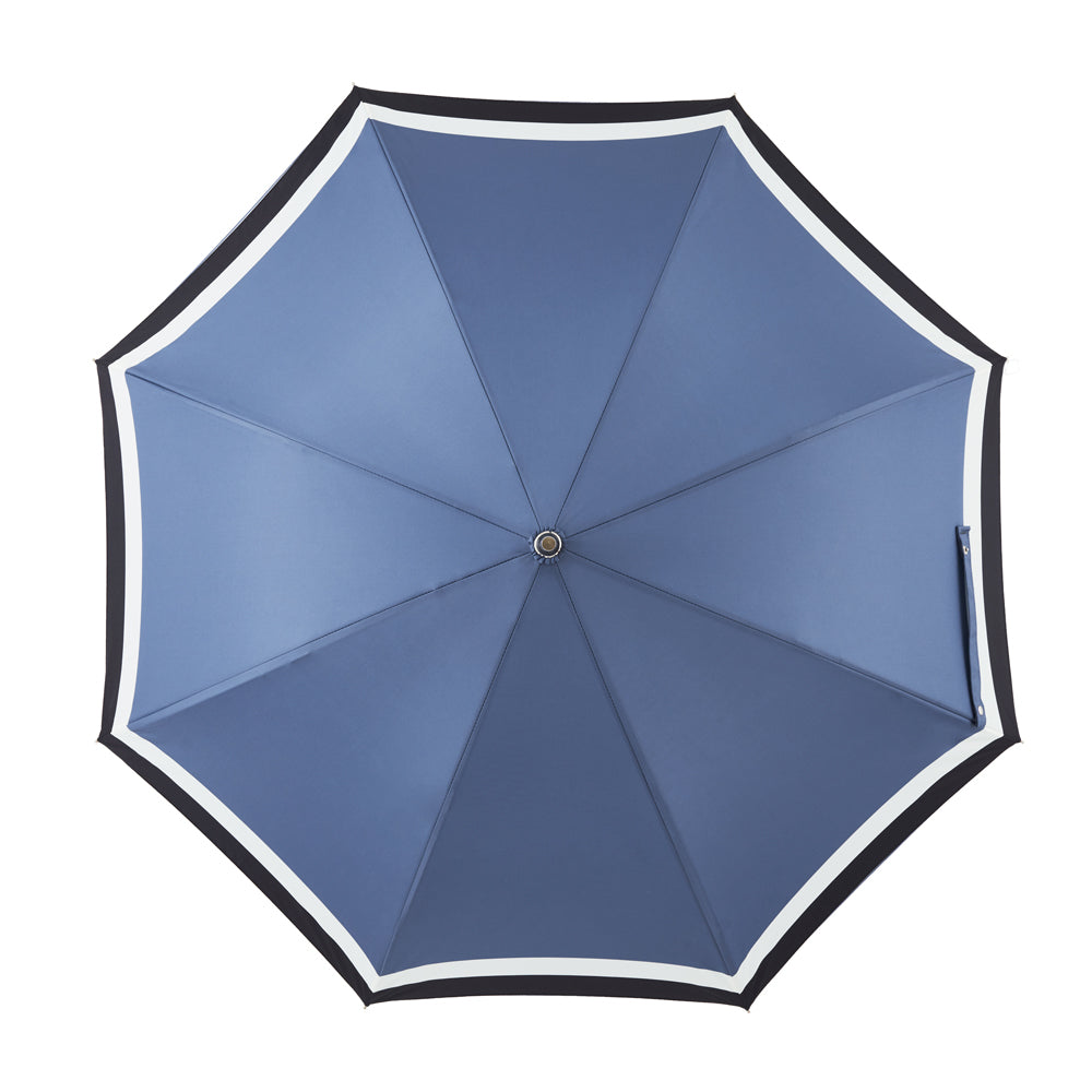 Alex umbrella comes with black leather handel. A dapper premium umbrella with pattern in blue, white and black. Double layer canopy extends the life of the umbrella fiberglass ribs and sturdy frames makes the umbrella wind and gust-resistant. No matter the forecast, the Alex umbrella will protect your style. | Harry Rain