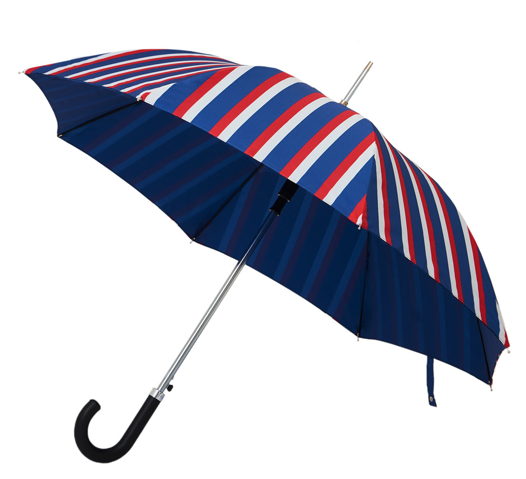 Our Bradley umbrella comes with black leather handel. A stylish and premium umbrella with pattern in blue, white and red. Double layer canopy extends the life of the umbrella and fiberglass ribs and frames makes the umbrella wind and gust-resistant. A brilliant umbrella to protect your style! | Harry Rain